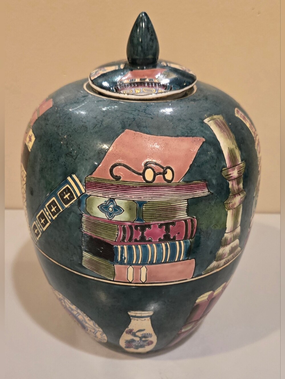 Decorative Teal Ceramic Jar with Book Motif